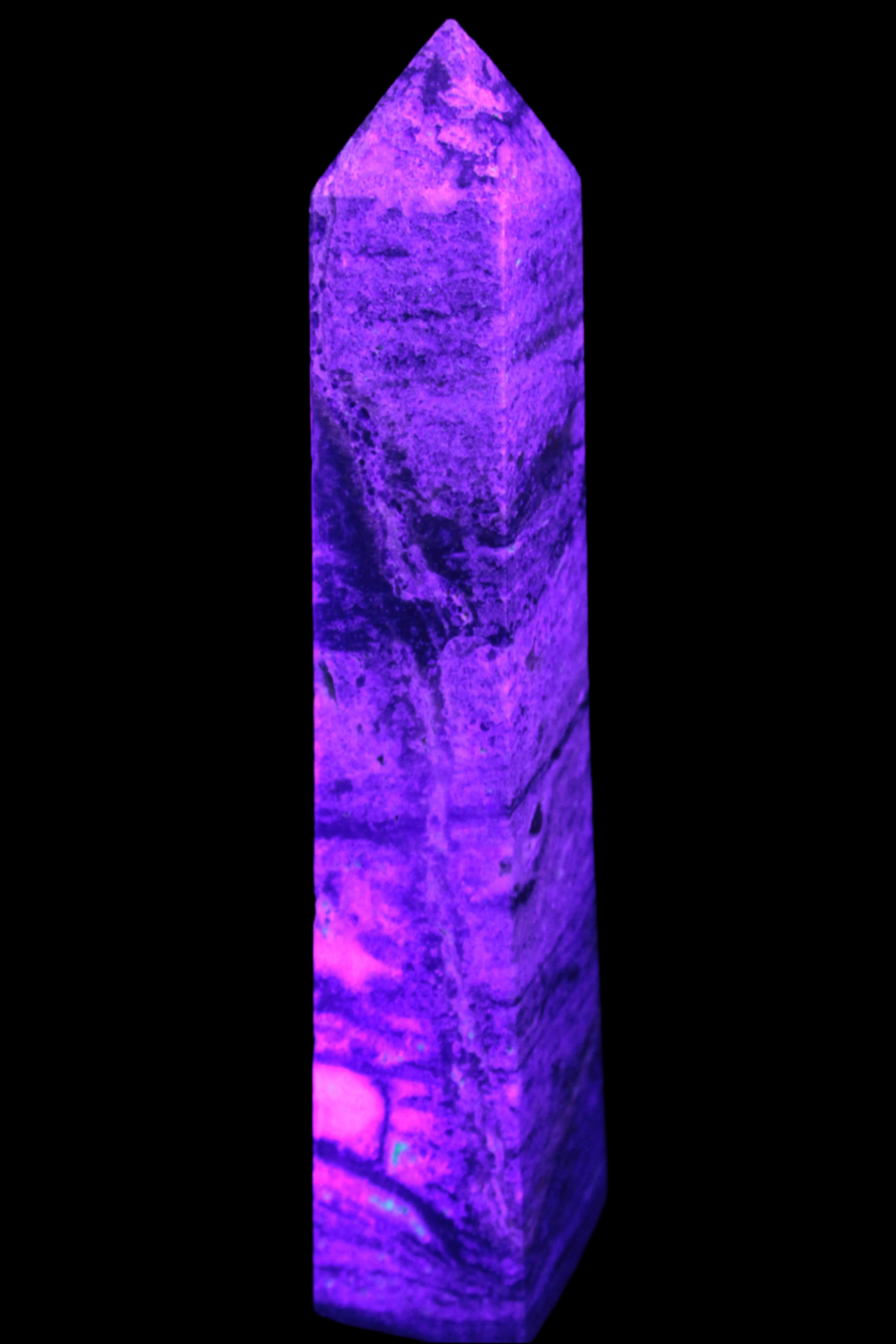 Purple Fluorite obelisk 715g in UV light - Rocks and Things Store