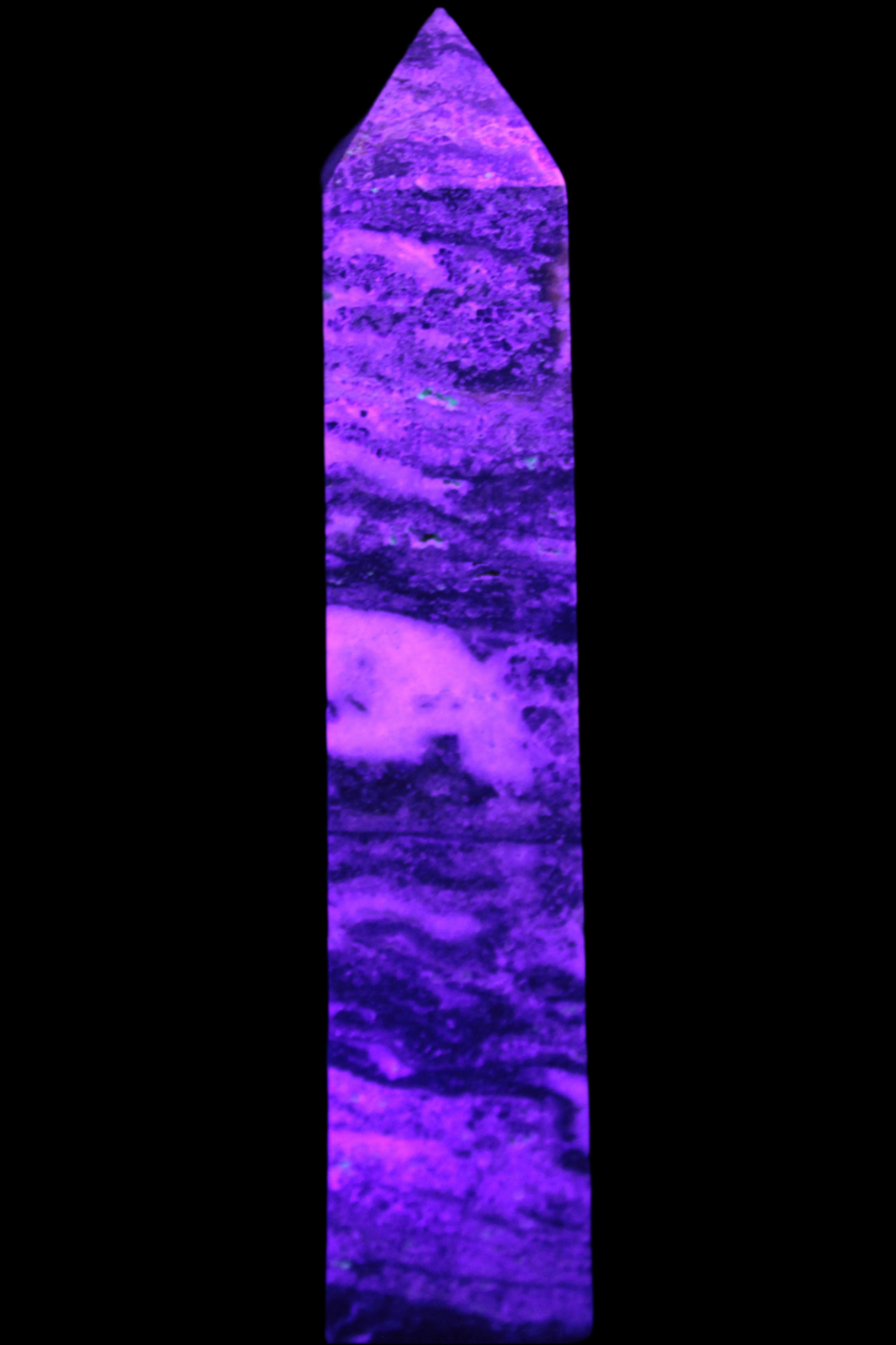 Purple Fluorite obelisk 715g in UV light - Rocks and Things Store