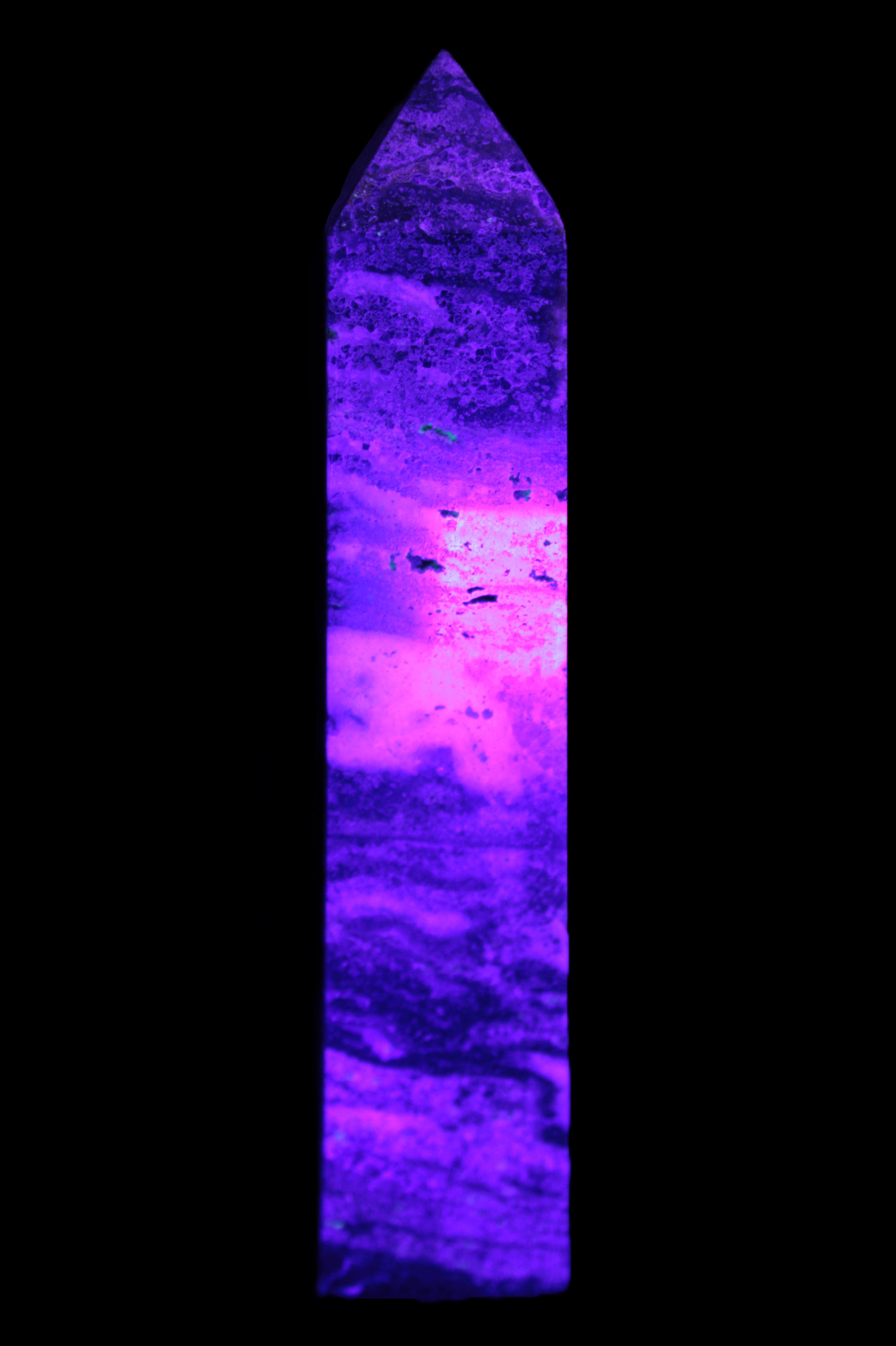 Purple Fluorite obelisk 715g in UV light - Rocks and Things Store
