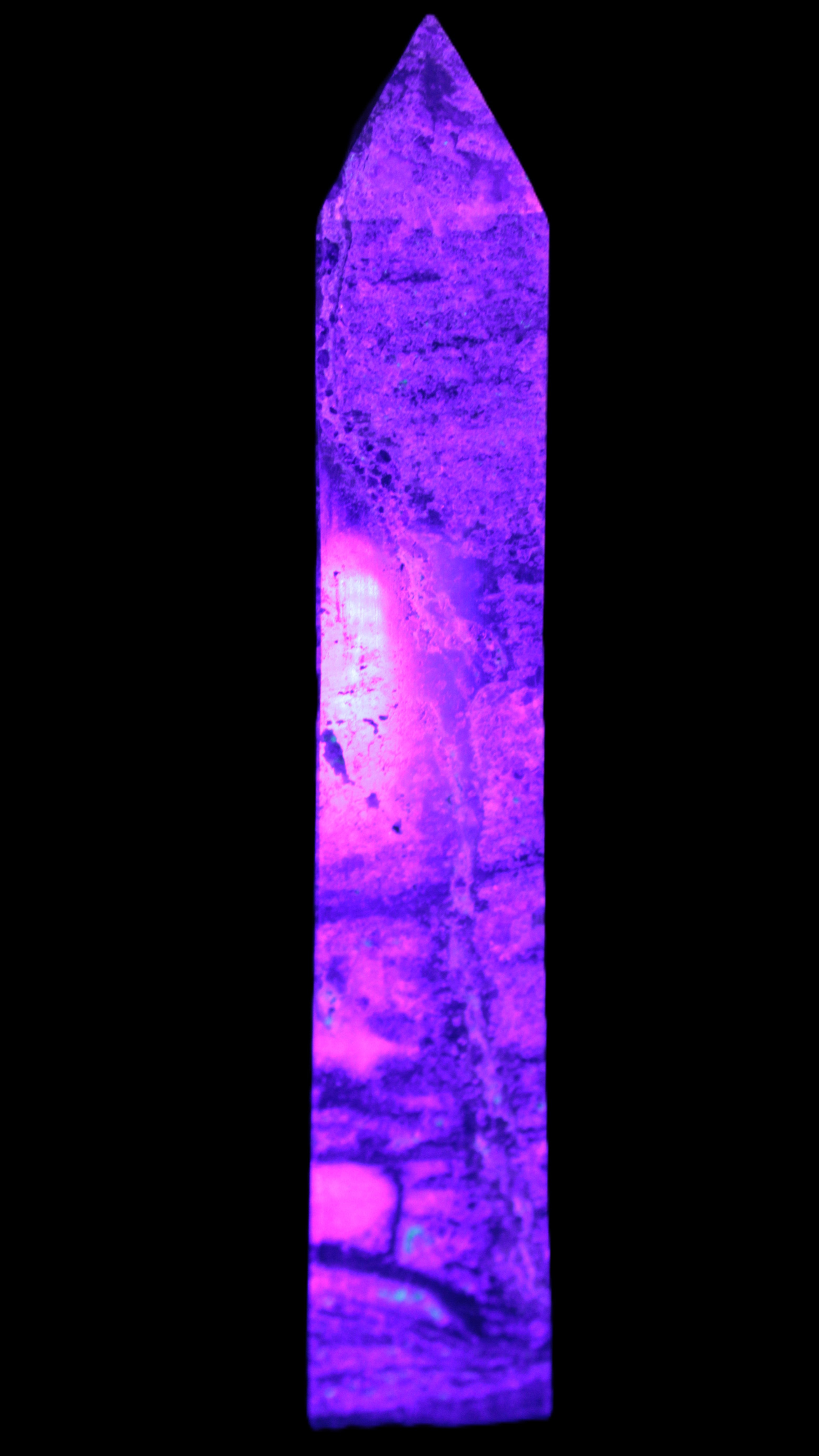 Purple Fluorite obelisk 715g in UV light - Rocks and Things Store