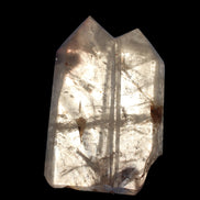 Clear Quartz double-pillar obelisk 1655g in dusk sunlight, held in hand