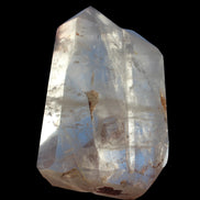 Clear Quartz double-pillar obelisk 1655g in sunshine, held in hand