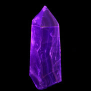 Dark Fluorite obelisk 180*76mm 1775g in UV light - Rocks and Things Store