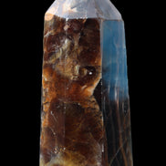 Dark Fluorite obelisk 180*76mm 1775g in sunlight - Rocks and Things Store