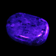 Larvikite thumbstone 20*30*6mm 12g in UV light - Rocks and Things Store
