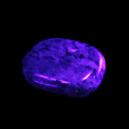 Larvikite thumbstone 20*30*6mm 12g in UV light - Rocks and Things Store