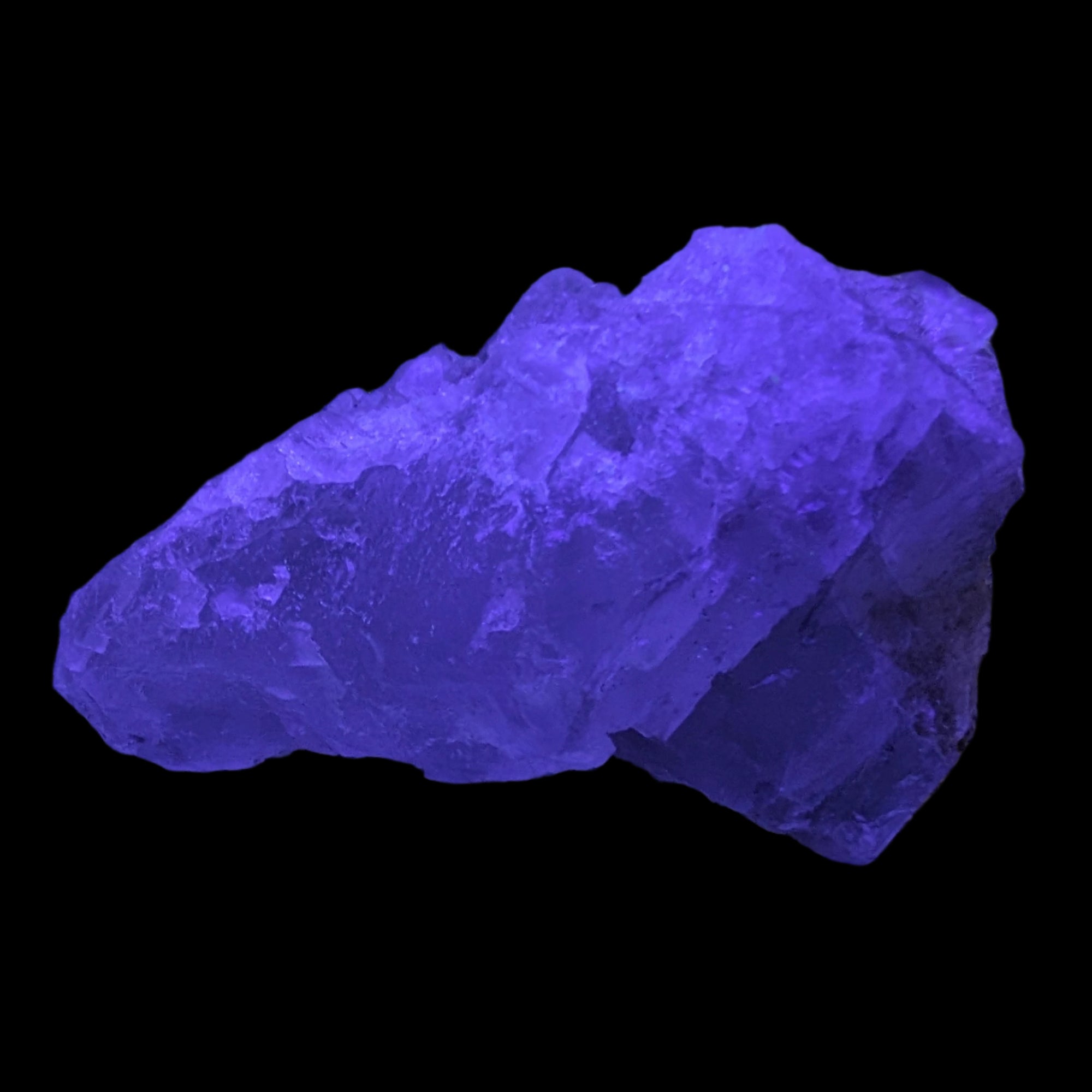 Clear Fluorite crystal 340g in UV light - Rocks and Things Store