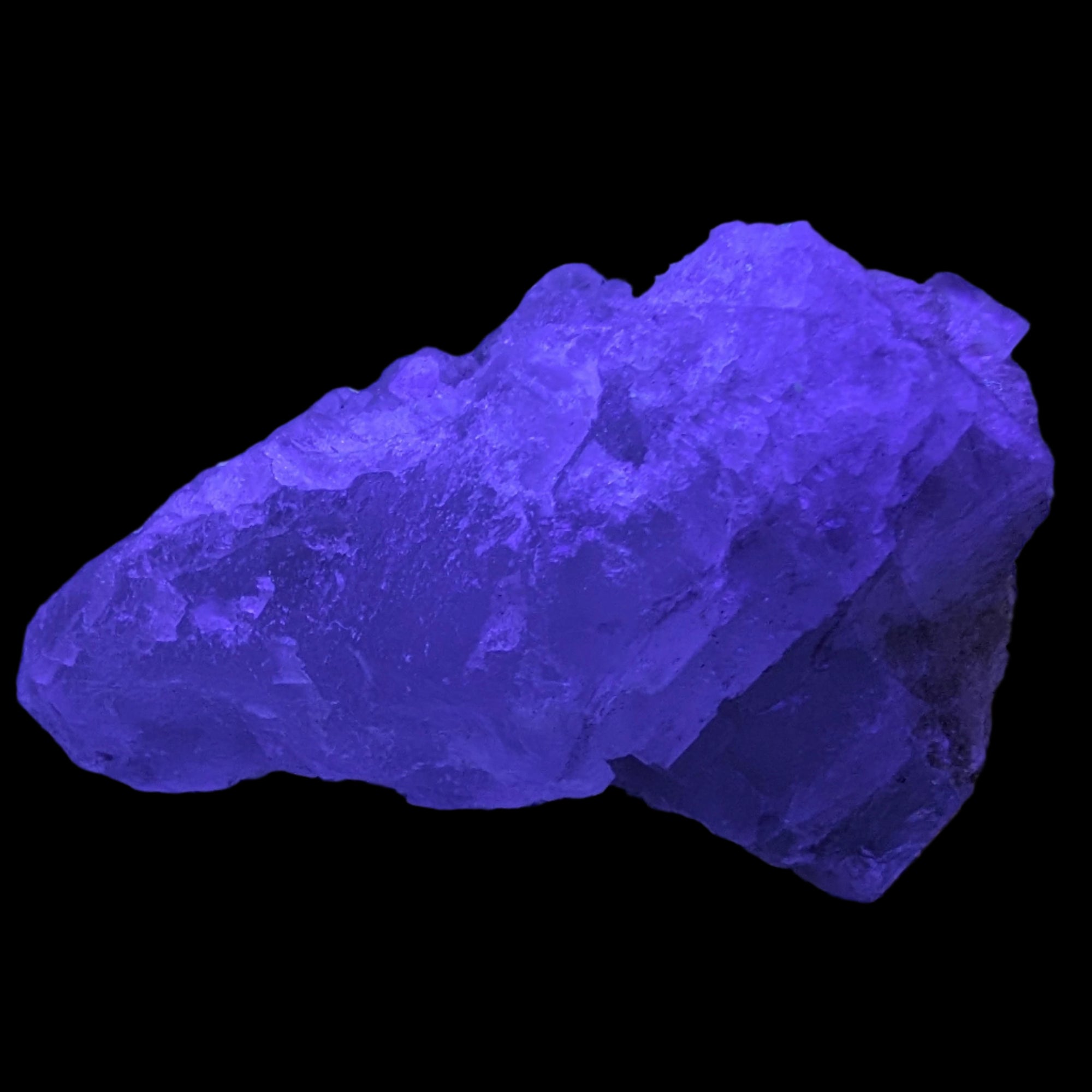 Clear Fluorite crystal 340g in UV light - Rocks and Things Store