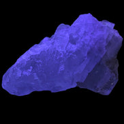 Clear Fluorite crystal 340g in UV light - Rocks and Things Store