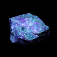 Blue Amber from Mozambique 1/2 pieces 37-40mm 14-20g in UV light - Rocks and Things Store