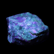 Blue Amber from Mozambique 1/2 pieces 37-40mm 14-20g in UV light - Rocks and Things Store