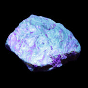 Blue Amber from Mozambique 1/2 pieces 37-40mm 14-20g in UV light - Rocks and Things Store