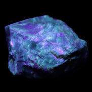 Blue Amber from Mozambique 1/2 pieces 37-40mm 14-20g in UV light - Rocks and Things Store