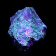 Blue Amber from Mozambique 1/2 pieces 37-40mm 14-20g in UV light - Rocks and Things Store