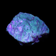 Blue Amber from Mozambique 14g in UV light - Rocks and Things Store