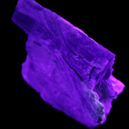 Kyanite blade cluster on Quartz 102*56*42mm 265g in UV light - Rocks and Things Store