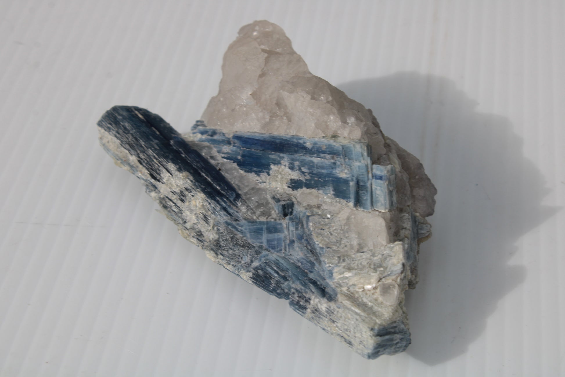 Kyanite blade cluster on clear Quartz 315g Rocks and Things