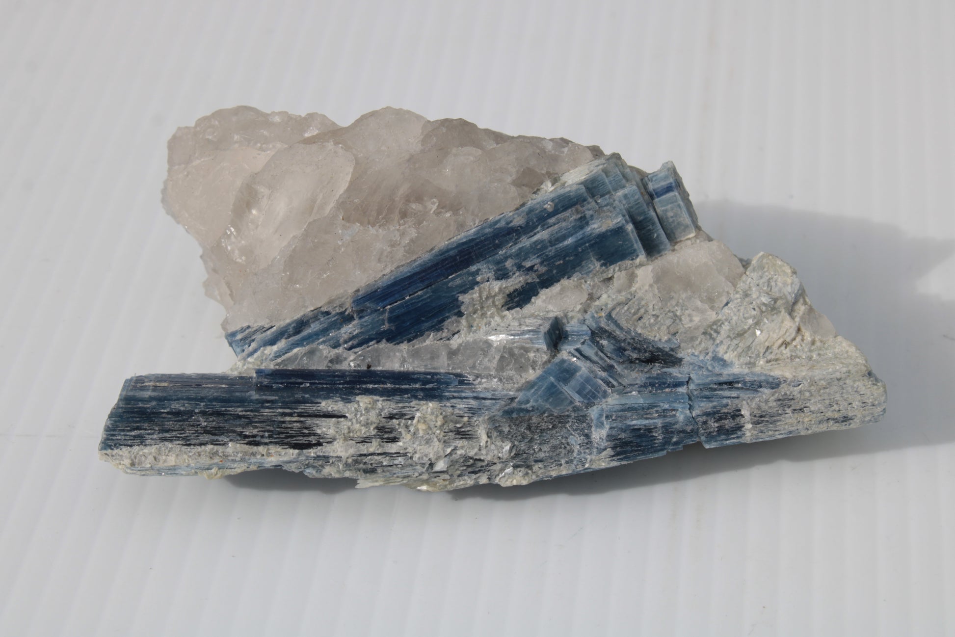 Kyanite blade cluster on clear Quartz 315g Rocks and Things