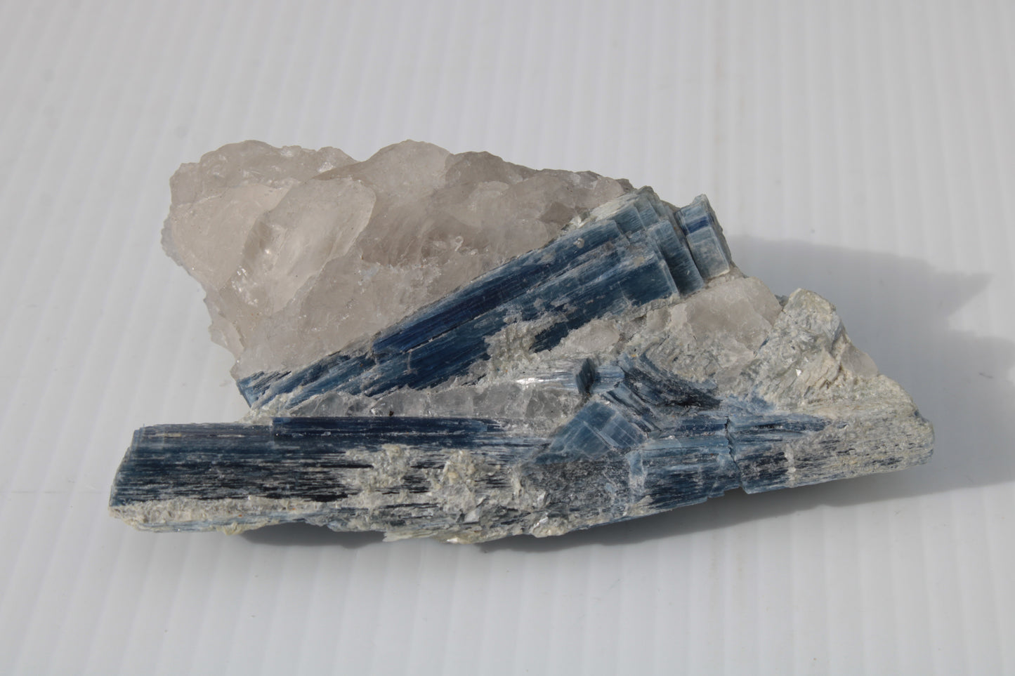 Kyanite blade cluster on clear Quartz 315g Rocks and Things