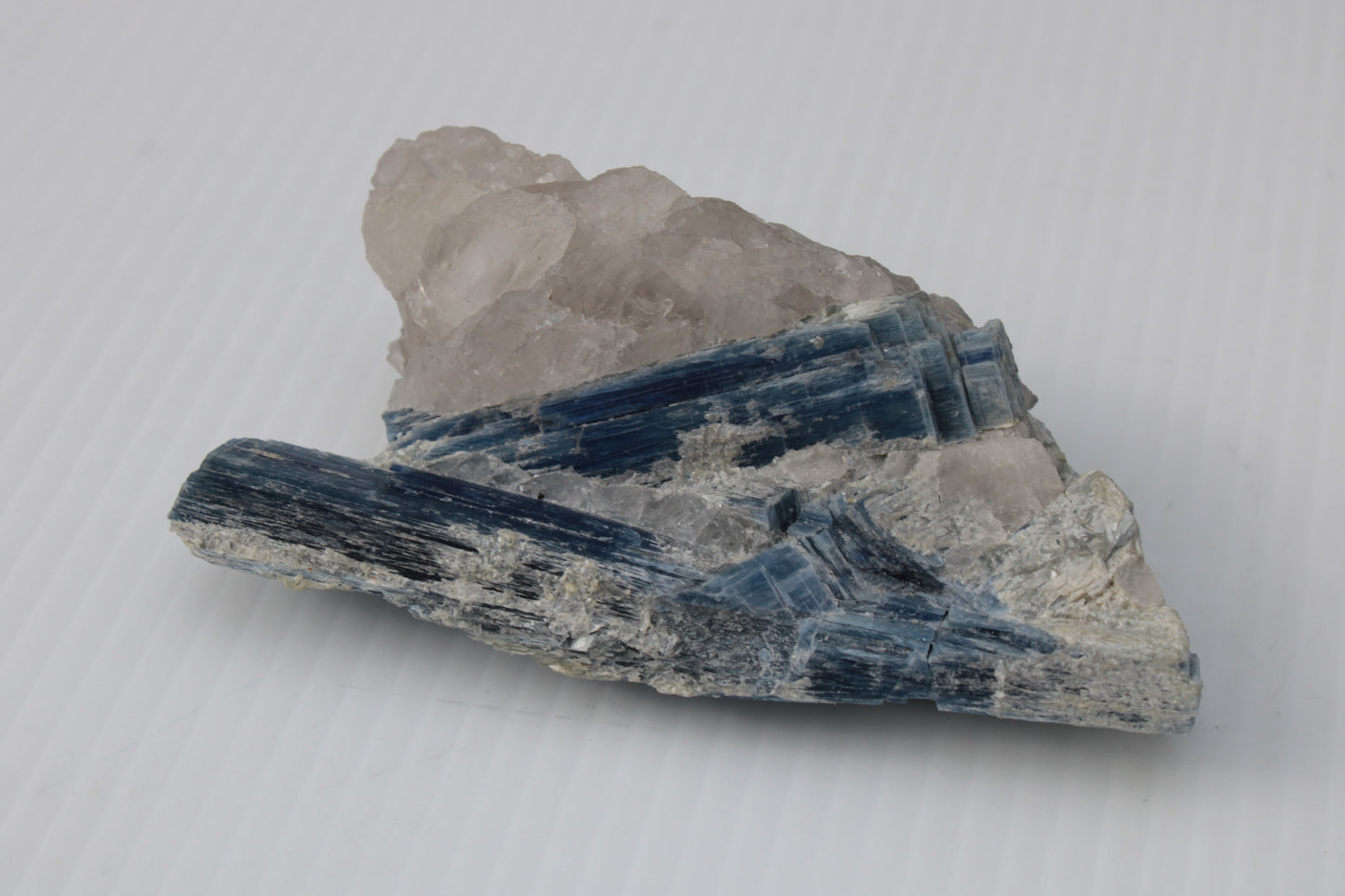 Kyanite blade cluster on clear Quartz 315g Rocks and Things