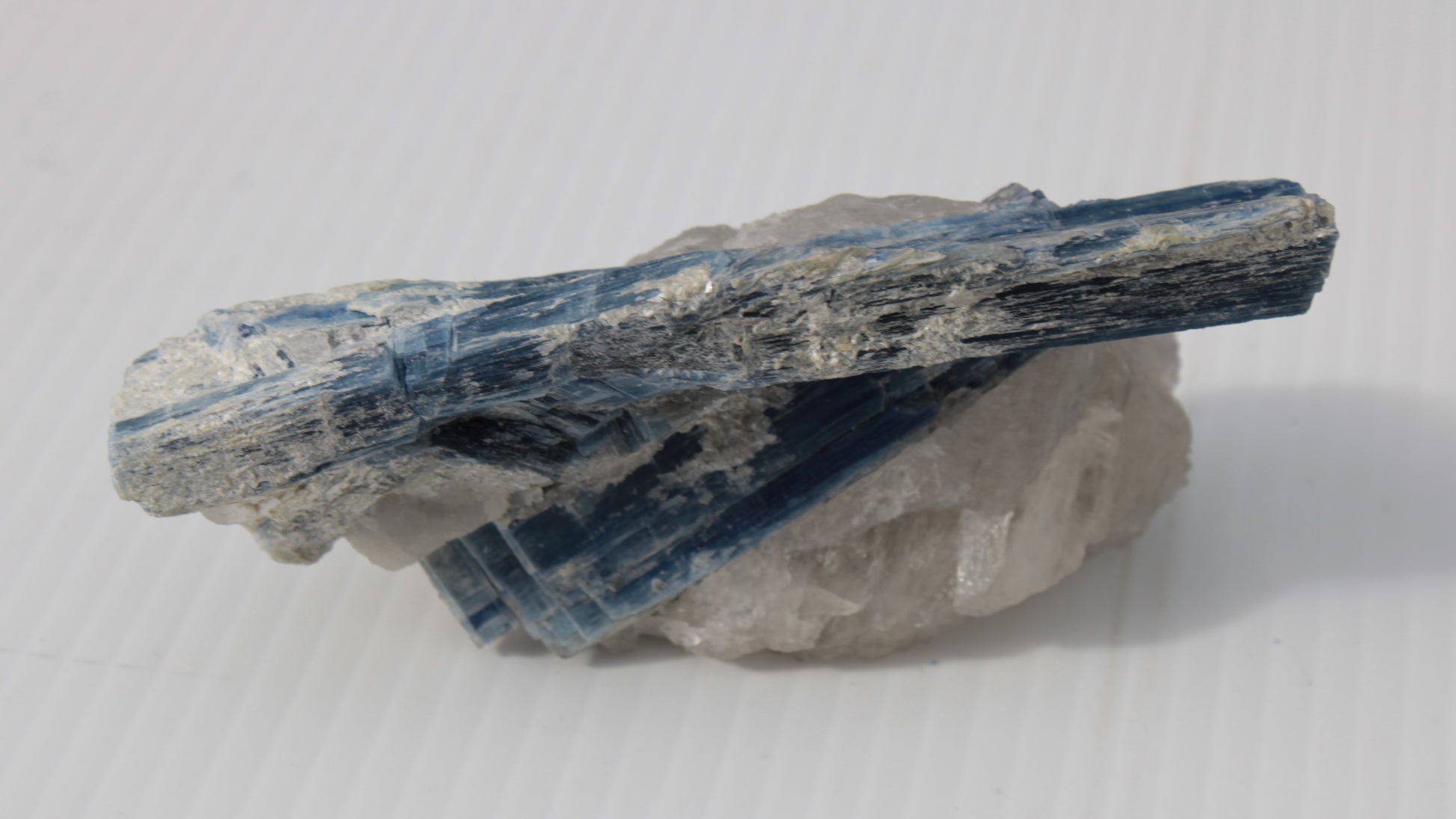 Kyanite blade cluster on clear Quartz 315g Rocks and Things