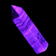 Caribbean Calcite Blue Aragonite wand 71g in UV light - Rocks and Things Store