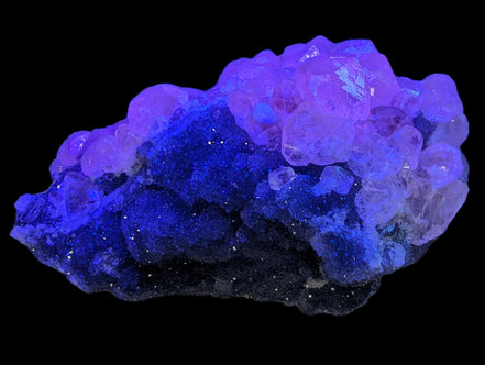 Sparkly Calcite fluorescent cluster 311.2g in UV light