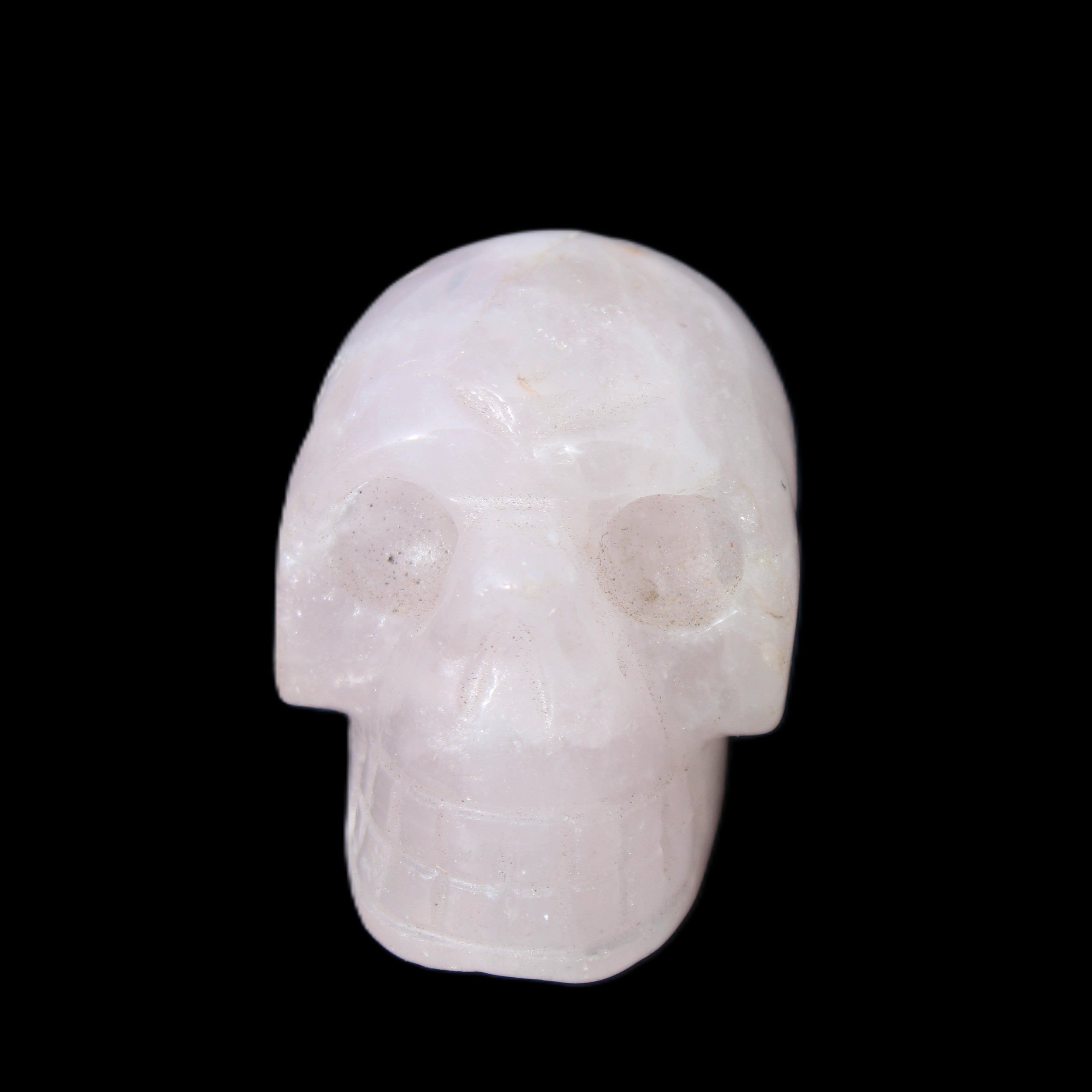 Rose Quartz hand-carved skull 51g in sunlight - Rocks and Things Store