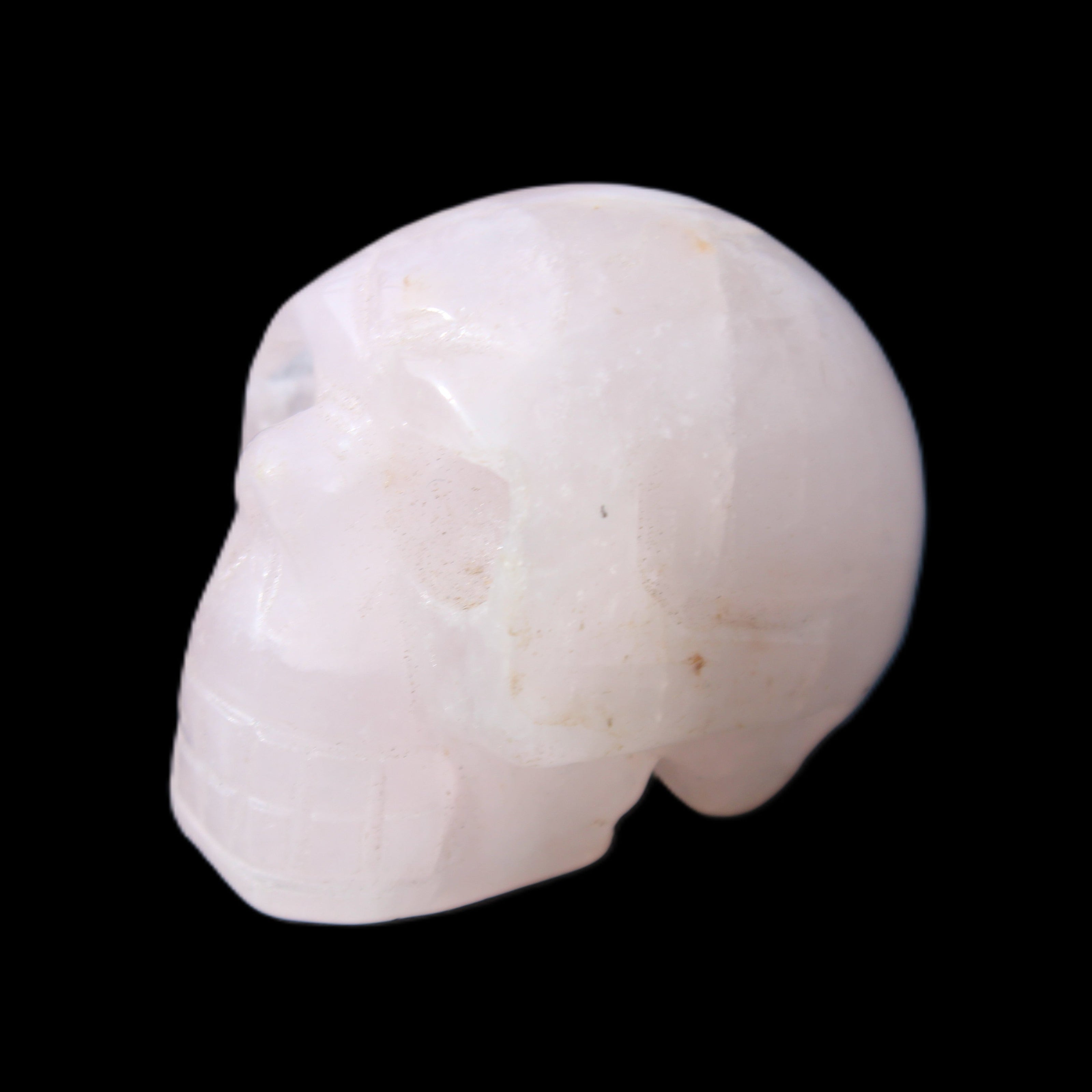 Rose Quartz hand-carved skull 51g in sunlight - Rocks and Things Store