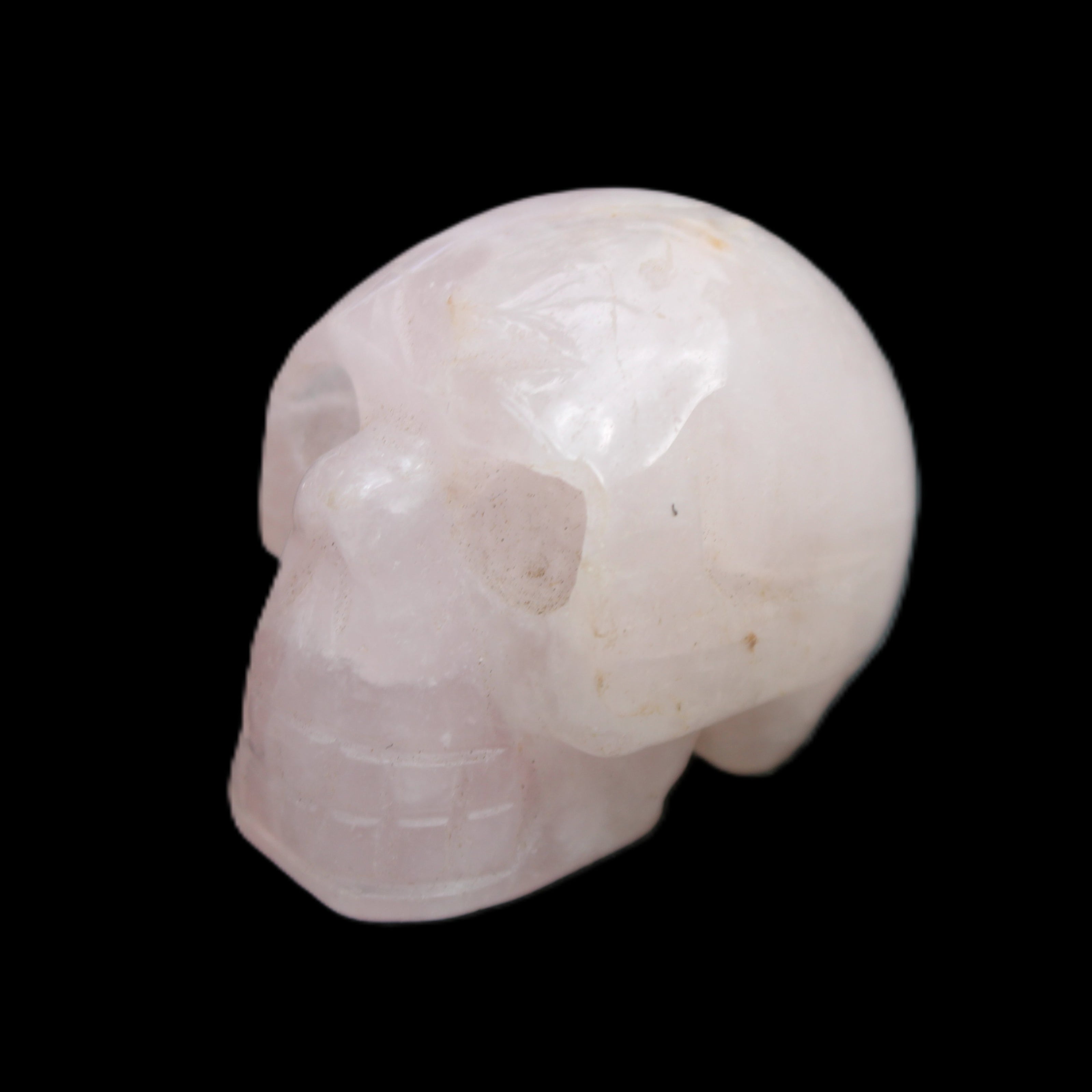 Rose Quartz hand-carved skull 51g in sunlight - Rocks and Things Store
