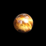 Tigers Eye small sphere 20mm 13g in sunlight - Rocks and Things Store