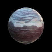 Zebra Stone Jasper sphere 569g in sunlight - Rocks and Things Store