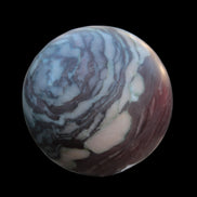 Zebra Stone Jasper sphere 569g in sunlight - Rocks and Things Store
