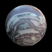 Zebra Stone Jasper sphere 569g in sunlight - Rocks and Things Store