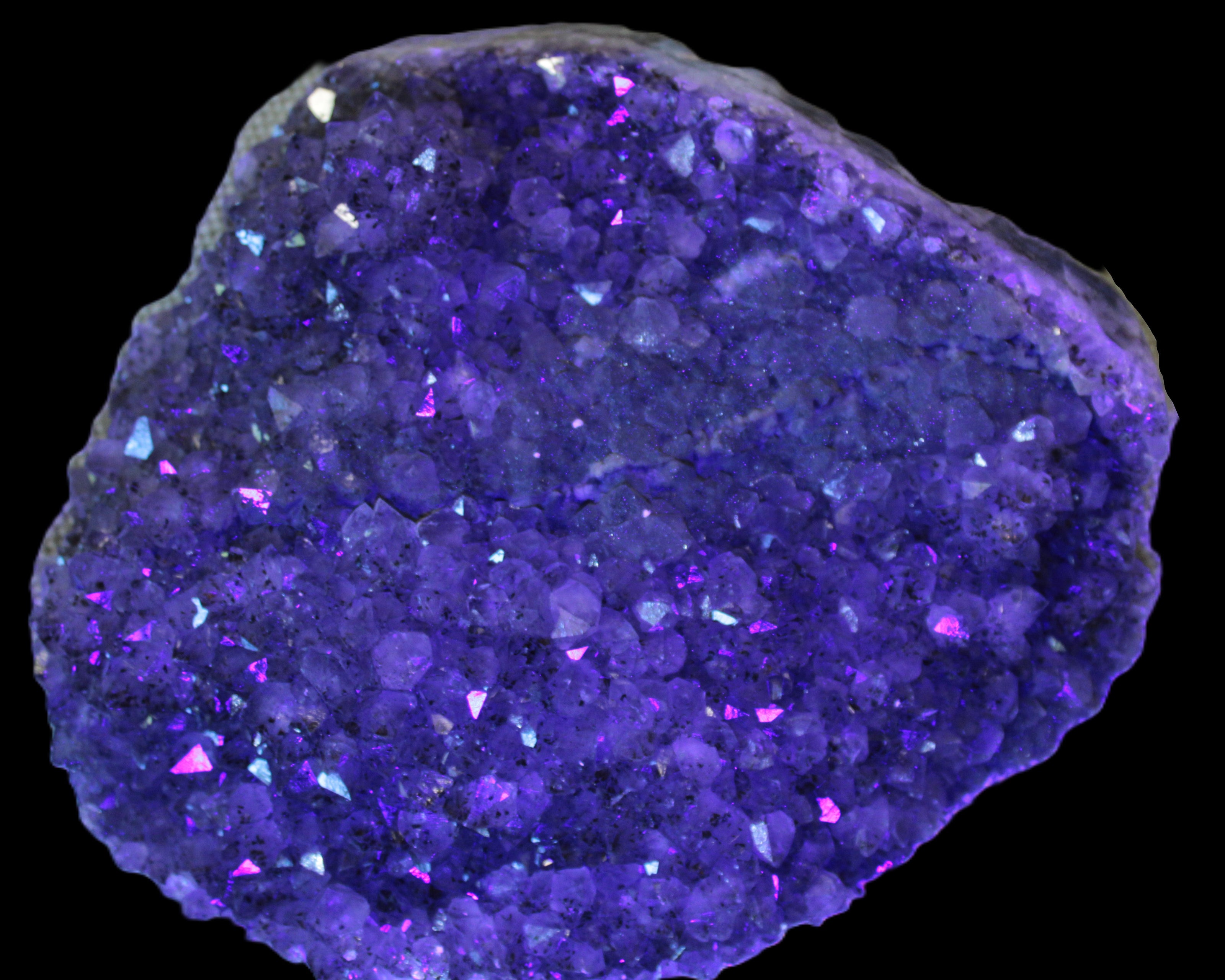 Amethyst geode cluster 5900g in UV light