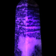Fluorite obelisk 214g in UV light - Rocks and Things Store