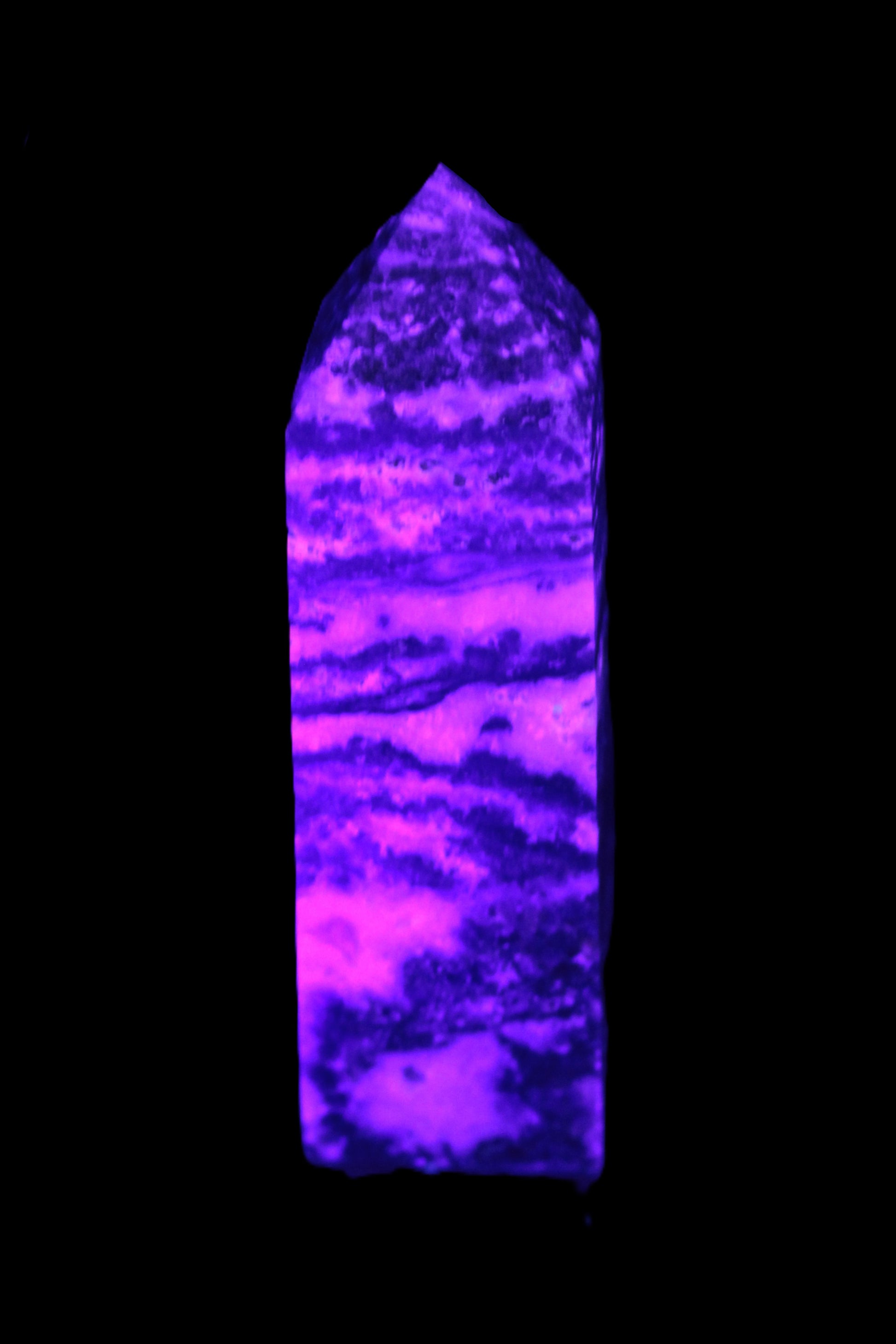 Fluorite obelisk 214g in UV light - Rocks and Things Store