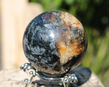 Astrophyllite Garnet sphere 268g