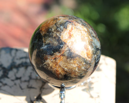 Astrophyllite Garnet sphere 268g