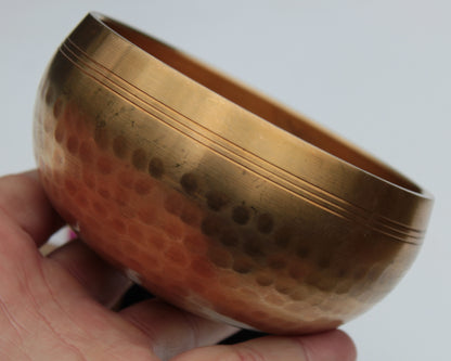 Tibetan hammered Meditation Singing Bowl with mallet and silk mat 100mm 330g Rocks and Things