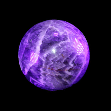 Chevron Fantasy Amethyst sphere 1389g in sunlight - Rocks and Things Store