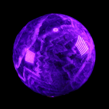 Chevron Fantasy Amethyst sphere 1389g in UV light - Rocks and Things Store