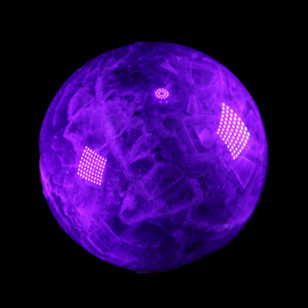 Chevron Fantasy Amethyst sphere 1389g in UV light - Rocks and Things Store