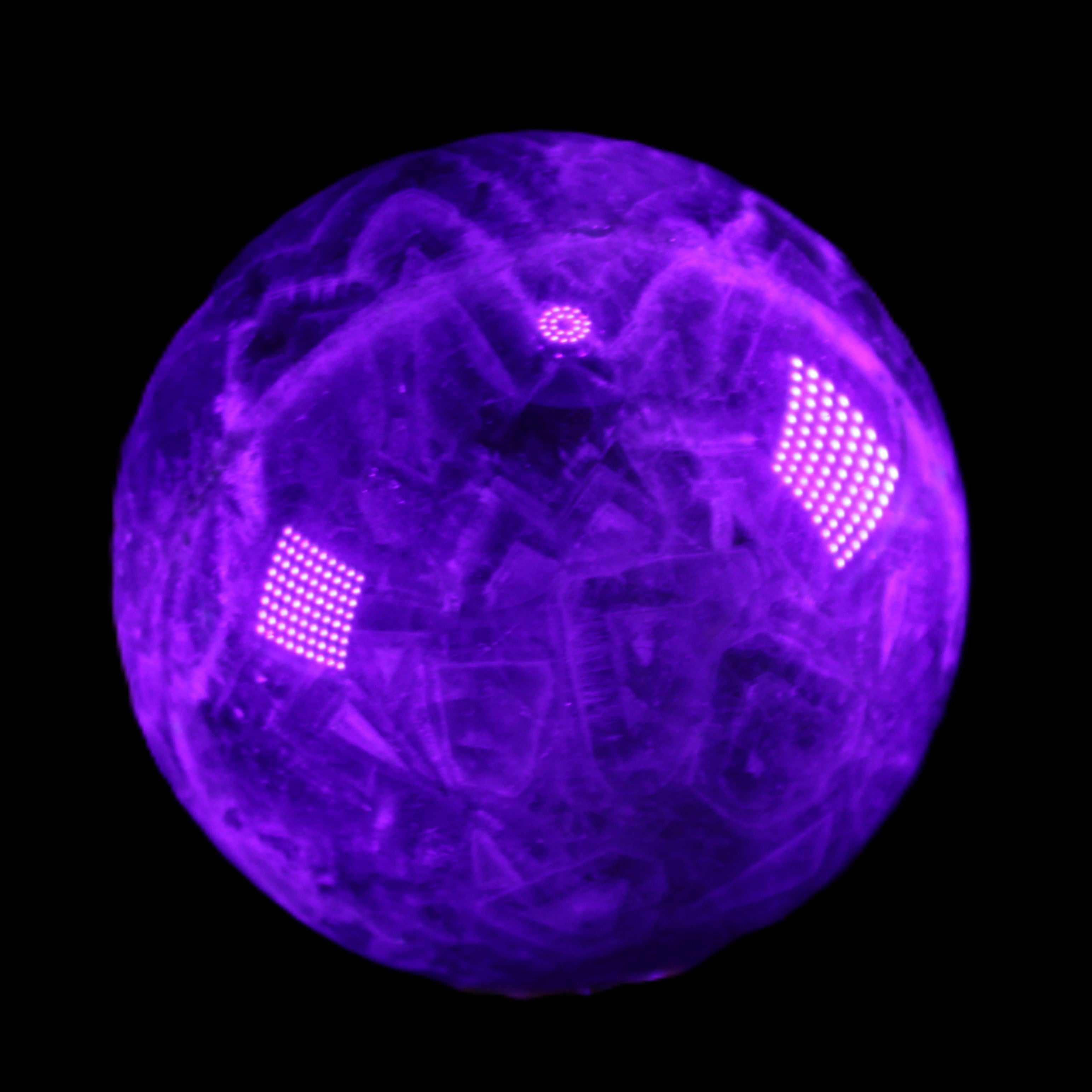 Chevron Fantasy Amethyst sphere 1389g in UV light - Rocks and Things Store
