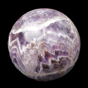 Chevron Fantasy Amethyst sphere 1389g in sunlight - Rocks and Things Store