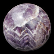 Chevron Fantasy Amethyst sphere 1389g in sunlight - Rocks and Things Store