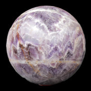 Chevron Fantasy Amethyst sphere 1389g in sunlight - Rocks and Things Store