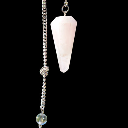 Rose Quartz faceted cone dowsing pendulum 34mm 9g in sunlight - Rocks and Things Store