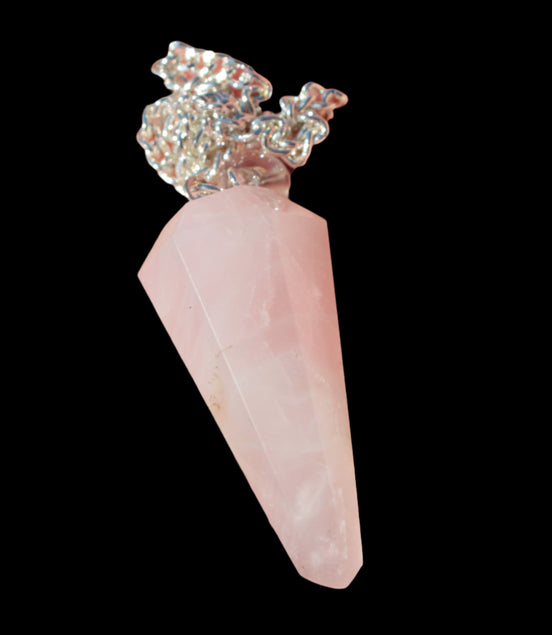 Rose Quartz faceted cone dowsing pendulum 34mm 9g in sunlight - Rocks and Things Store