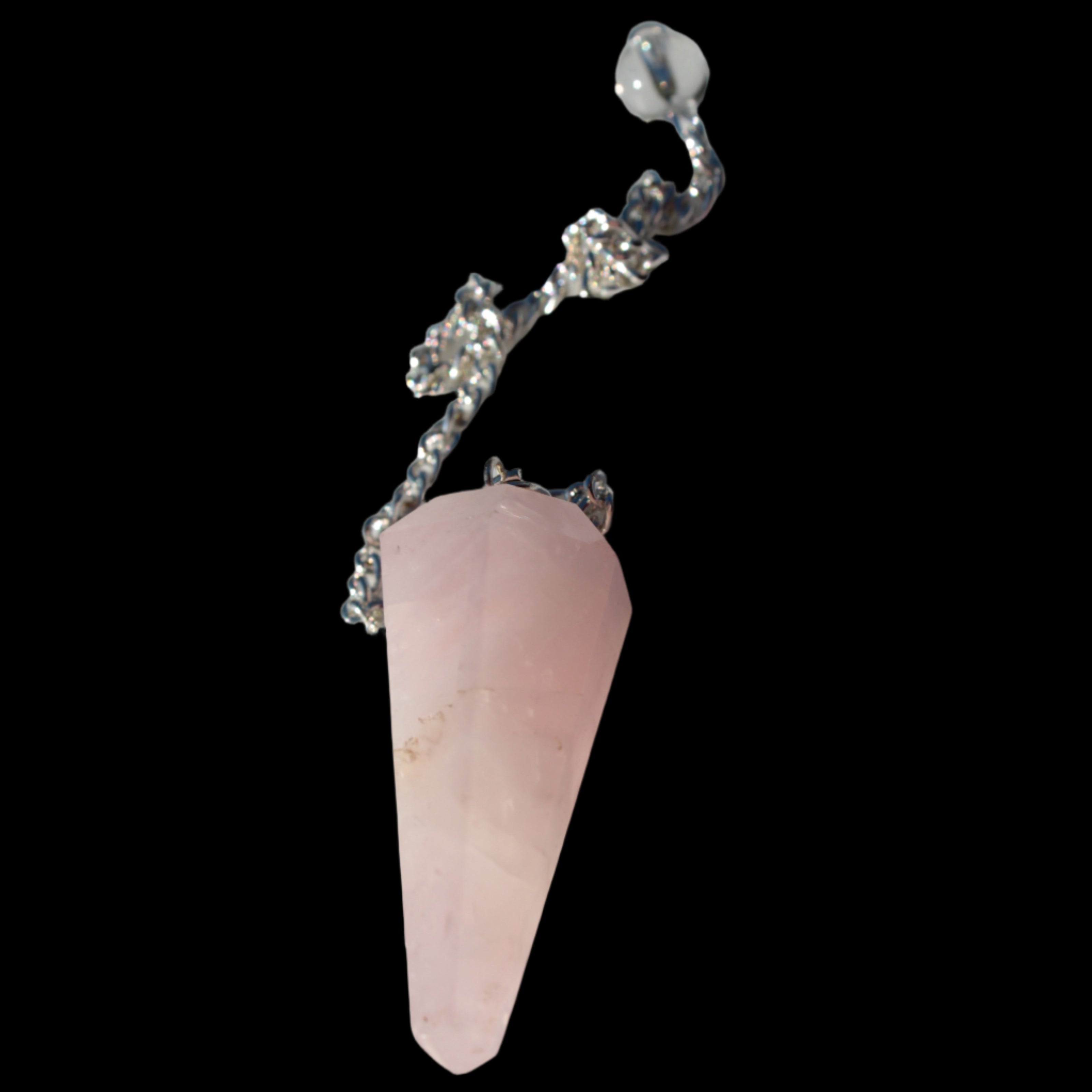 Rose Quartz faceted cone dowsing pendulum 34mm 9g in sunlight - Rocks and Things Store